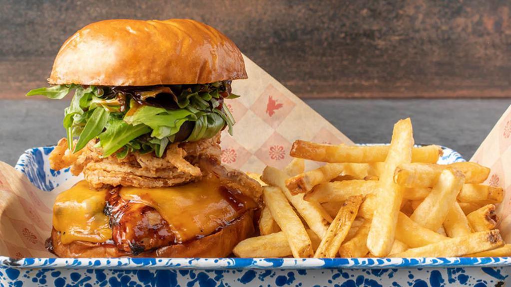 **New** Smoked Bbq Chicken Sandwich · Smoked chicken breast lightly grilled with cheddar cheese, applewood bacon, crispy onion straws and lettuce slathered with original BBQ sauce on a grilled brioche bun.