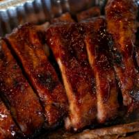 Baby Back Ribs Full Rack · Rack of the tenderest, meatiest little pork ribs, slow-cooked with sweet hickory smoke, then...