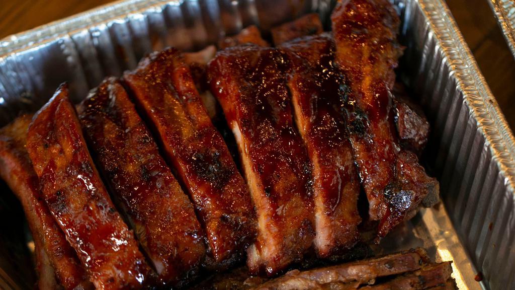 Baby Back Ribs Full Rack · Rack of the tenderest, meatiest little pork ribs, slow-cooked with sweet hickory smoke, then grilled and basted with our special BBQ sauce.