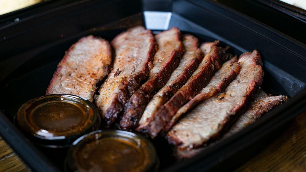 TRI TIP PER POUND · Certified Angus Beef tri tip, smoked all day until it melts in your mouth. Hand-carved to order with our savory mop sauce. Order by Pound