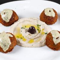 Falafel · Gluten-free. On a bed of hummus.
