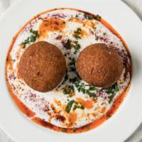 Icli Kofte · Bulgur stuffed with spicy ground beef with crushed walnuts, pan-fried, served with garlic yo...