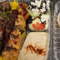 Mixed Grill Platter · A combo of chicken, beef, and lamb shawarma with rice, hummus, grilled onions and bell peppe...