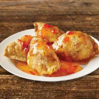 Fried Chicken Dumplings (4 Pieces) · Chicken wrapped in savory dough, served with sweet chili sauce.