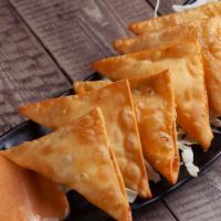 Crab Rangoons (6 pcs) · Deep fried wonton wrappers filled with cream cheese and imitation crab. Comes with a side of...