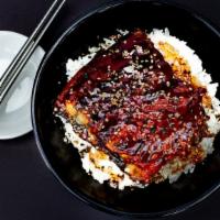 Unagi Rice · Grilled Japanese eel on rice topped off with sesame and unagi sauce.