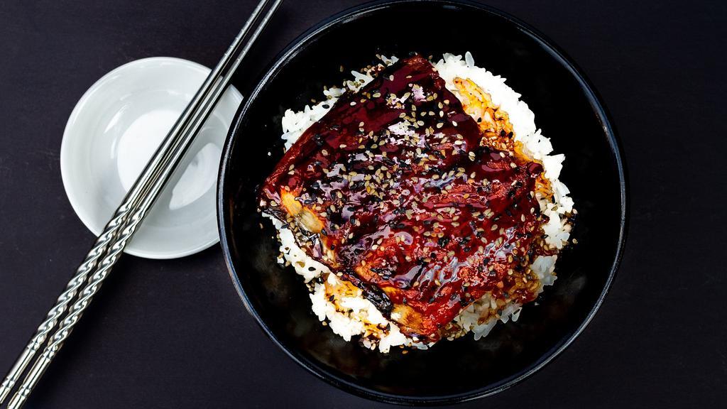 Unagi Rice · Grilled Japanese eel on rice topped off with sesame and unagi sauce.