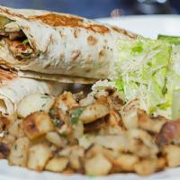 Chicken Shawarma · Sliced chicken breast marinated and grilled, wrapped in lavash with creamy garlic, and pickl...
