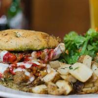 Mediterranean · Grilled eggplant, roasted peppers, tomatoes, pesto, and provolone on focaccia.