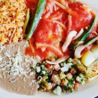 Chilaquiles · beans, potatoes with bell pepper, onions, sour cream , eggs, and choice green or red sauce
