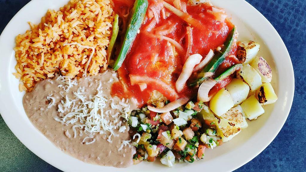 Chilaquiles · beans, potatoes with bell pepper, onions, sour cream , eggs, and choice green or red sauce