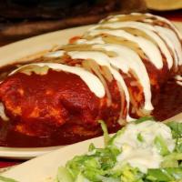 Burrito Mojado · Super burrito, topped with enchilada sauce and melted cheese.