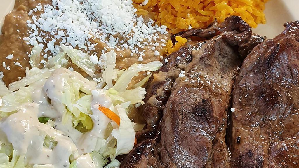 Carne Asada Plate · Served with rice, pico de gallo and guacamole.