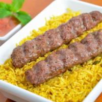 Adana Kabab Meal (Rice & Salad) · Fresh off the grill Adana Lamb skewers served on a bed of rice with a side salad.