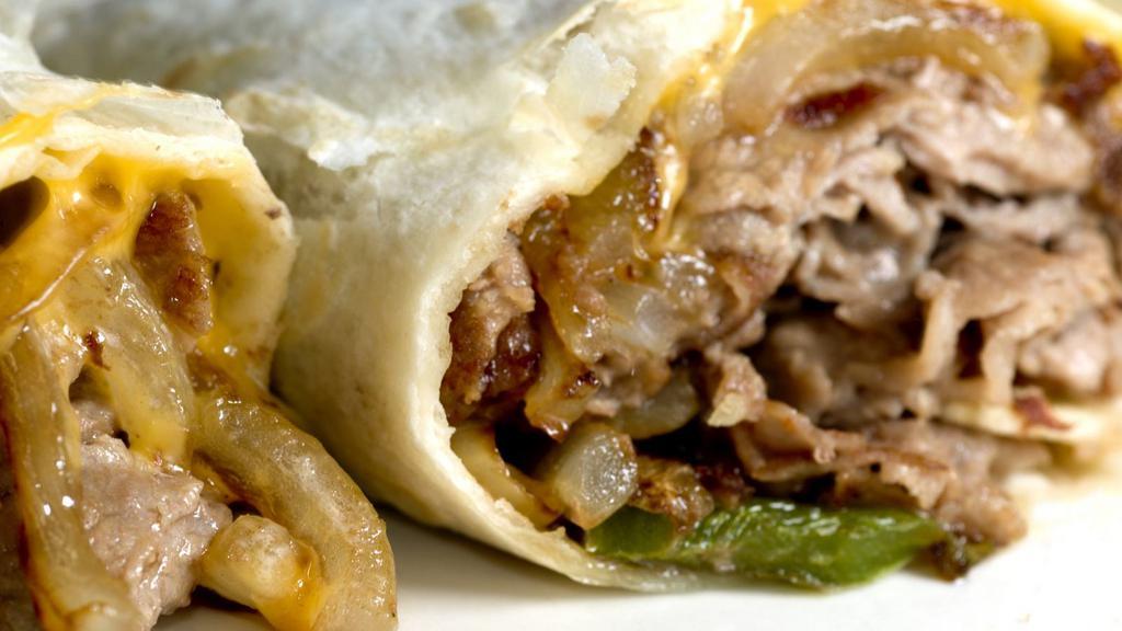 Philly Wrap with Jalapeños · Fresh wrap made with Gyro meat, jalapeños, grilled mushrooms, bell peppers, onions, and Swiss cheese.