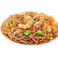 Pancit Canton · Stir fried noodles with a sweet-salty soy-based sauce, topped with succulent fish balls slic...