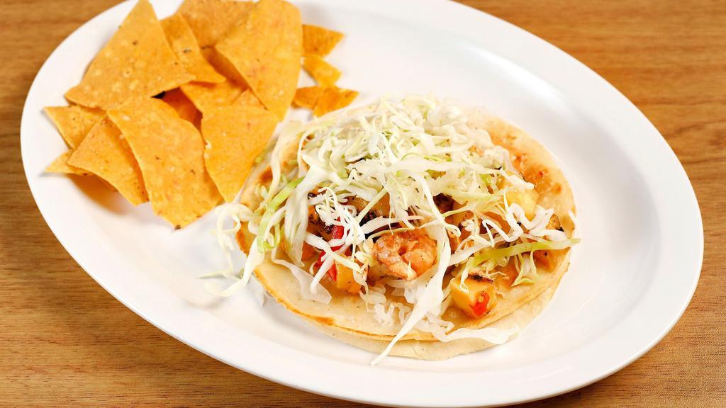 Shrimp · Our famous grilled shrimp taco served in a soft corn tortilla with cabbage, chipotle sauce and pineapple salsa.