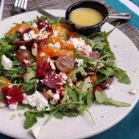 Spinach & Strawberry Salad · Fresh spinach, brie cheese, roasted red peppers, sweet red onion, sliced strawberries, candi...