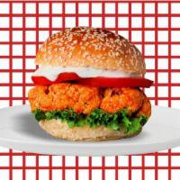 Triple Crispy Chicken Burger  · Triple crispy chicken, mayo, buffalo sauce, lettuce, tomato, onion, and American cheese.
