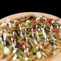 NACHO FRIES  · Fries topped with melted cheese, choice of meat, sour cream, guacamole, and salsa.