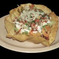 TACO SALAD · Flour tortilla bowl filled with meat, whole pinto beans, rice, lettuce, cheese, sour cream a...