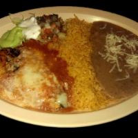CHILE RELLENO · Roasted pepper stuffed with cheese, covered in egg batter, and mild tomato sauce, served wit...