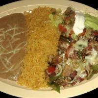 ALAMBRE  · Meat strips grilled with bacon, bell peppers and topped with melted cheese, served with rice...
