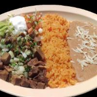 LENGUA PLATE · Beef tongue  served with rice, refried beans topped with cheese, sour cream, guacamole, sals...