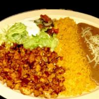 GRILLED CHICKEN PLATE · Marinated grilled chicken served with rice, refried beans topped with cheese, sour cream, gu...