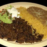 AL PASTOR PLATE · Marinated pork  served with rice, refried beans topped with cheese, sour cream, guacamole, s...