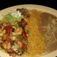 A LA PLANCHA SHIMP · Shrimp grilled with bacon, bell peppers, onions, and topped with cheese.  Served with rice, ...