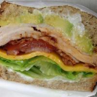 Chipotle Dagwood Sandwich · Spicy. Turkey, bacon, avocado, chipotle mayo, lettuce, tomato, onion and Cheddar on toasted ...