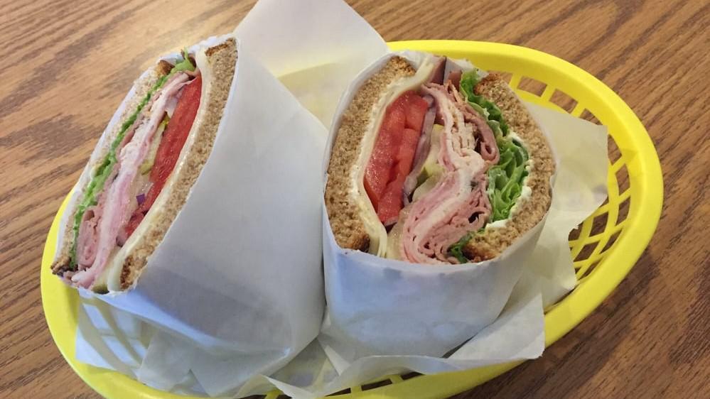 Supreme · Turkey, ham, roast beef on Dutch crunch with Swiss comes with mayo, mustard, lettuce, tomato, red onions, pickles.