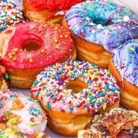 Mixed Dozen  · Includes all normal sized donuts, and fancy customs (DOES NOT  include twists, bars, fritter...