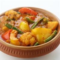 Vegan Mixed Vegetable Curry · Fresh mixed vegetables cooked with herbs and indian spices.