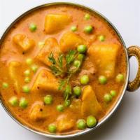 Vegan Aloo Mutter · Fresh cooked potatoes with green peas.