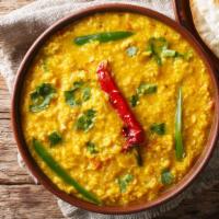 Vegan Daal · Yellow lentils smothered in chef's special sauce with a touch of spices.