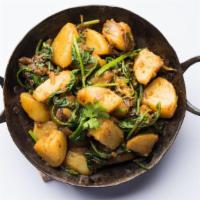 Vegan Aloo Palak · Fresh cooked potatoes with ginger, garlic and spinach curry.