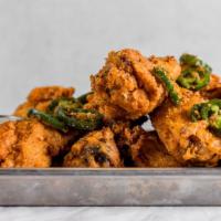 Tad's Wings · light and crispy chicken wings, tossed with garlic, jalapeños, and house hot sauce (optional...