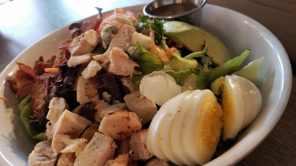 Tad's Cobb Salad · fresh mixed salad greens, avocado, hard boiled eggs, bacon, chicken breast, blue cheese with a honey dijon balsamic vinaigrette