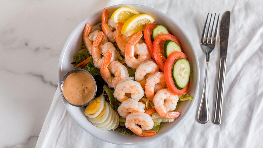 Shrimp Louie Salad · chilled poached shrimp on fresh salad greens, hard boiled eggs, tomatoes, and creamy louie dressing