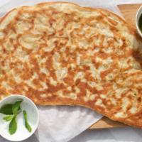 Potato Bolani · Flat bread dough filled with delicious potato filling and fried. Served with plain yogurt an...