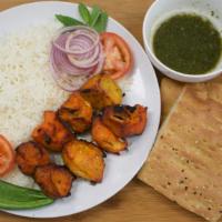 Chicken Breast Kabob · Boneless chicken breast cubes, marinated, and char-broiled. Served with white rice, afghan b...
