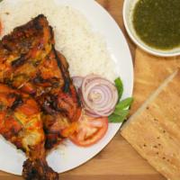 Tandoori Chicken · 2 Chicken quarter legs, marinated and cooked in a tandoor. Served with white rice, afghan br...