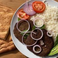 Chapli Kabob · 2 Ground beef patties, marinated and grilled. Served with white rice, afghan bread, shor nak...
