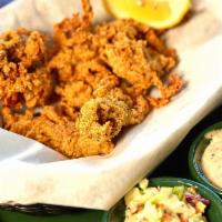 Fried Oyster Basket · Four large oysters, deep fried in a Cajun cornmeal batter and served with a side of rémoulad...