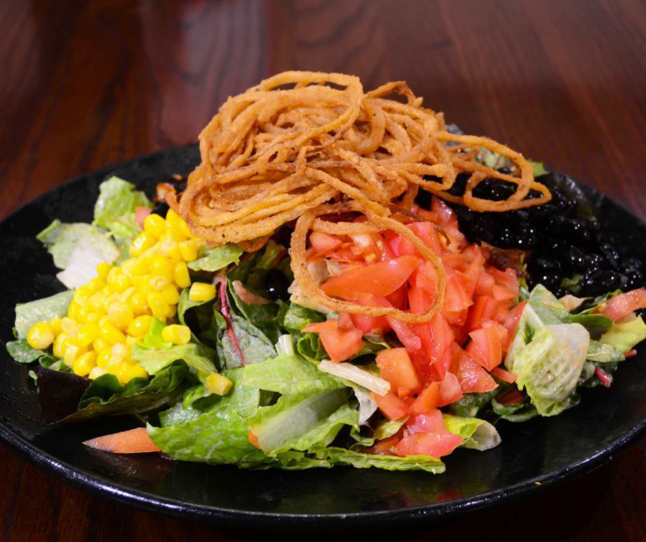 BBQ Chicken Salad · Mixed greens topped with BBQ chicken, black beans, tomatoes, corn & crispy onions, served with our BBQ ranch dressing.