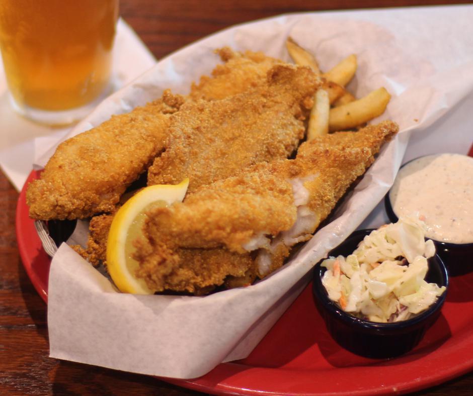 Fried Catfish Basket · Three catfish filets marinated in buttermilk, tossed in Cajun cornmeal, and fried to perfection. Served over a bed of fries, hush puppies, or choice of dinner side.
