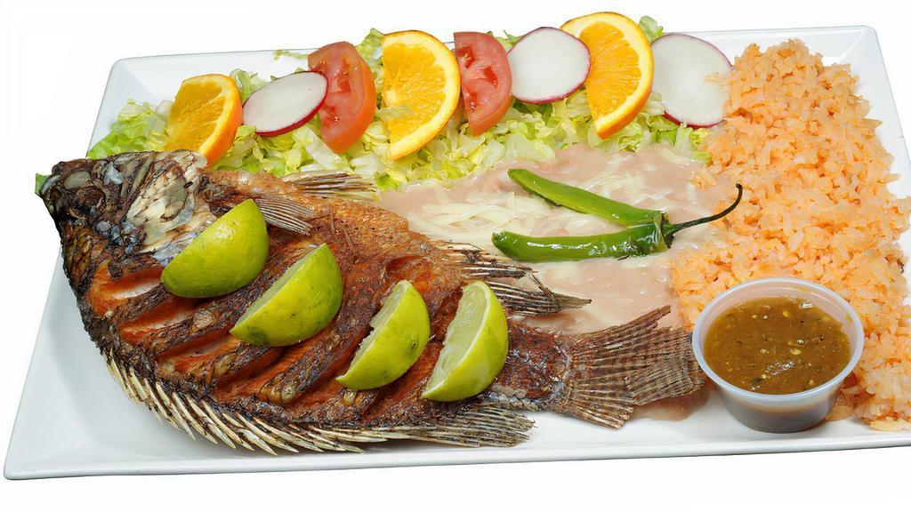 Mojarra Frita · fried mojarra fish with, salad, rice & beans