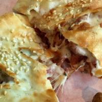 Pastrami Hot Hat · Thinly sliced pastrami with melted swiss cheese stuffed into our pizza dough shell and toppe...